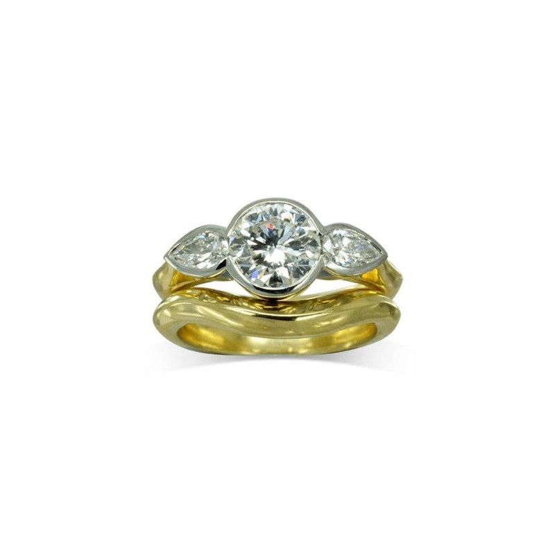 Round Brilliant and Pear Shaped Diamond Trilogy Ring