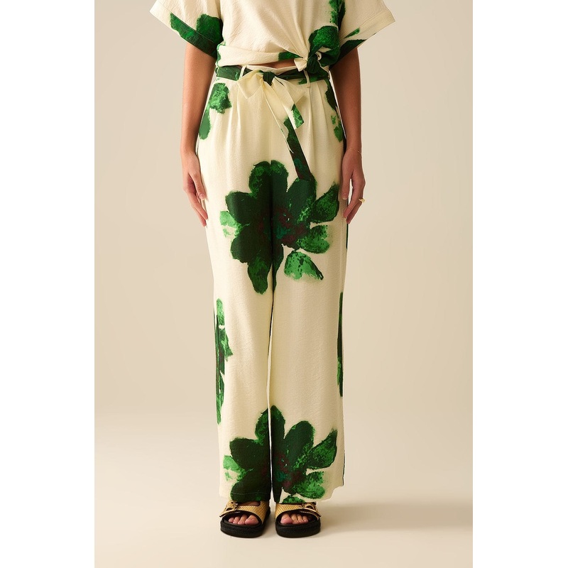 White Palazzo Pants With Green Tropial Flower Print And Matching Belt