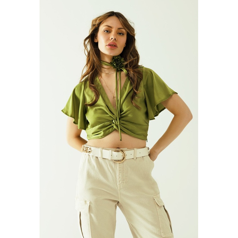 Green V-Neck Crop Top With Short Sleeves And A Flower Detail On The Neck