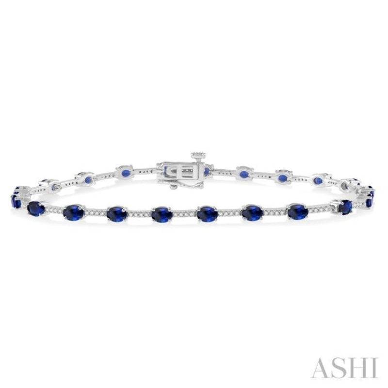 1/3 Ctw Round Cut Diamond & 4x3MM Oval Cut Sapphire Precious Bracelet in 10K White Gold