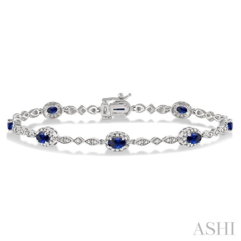 5×3 MM Oval Cut Sapphire and 1/20 ctw Single Cut Diamond Bracelet in 14K White Gold