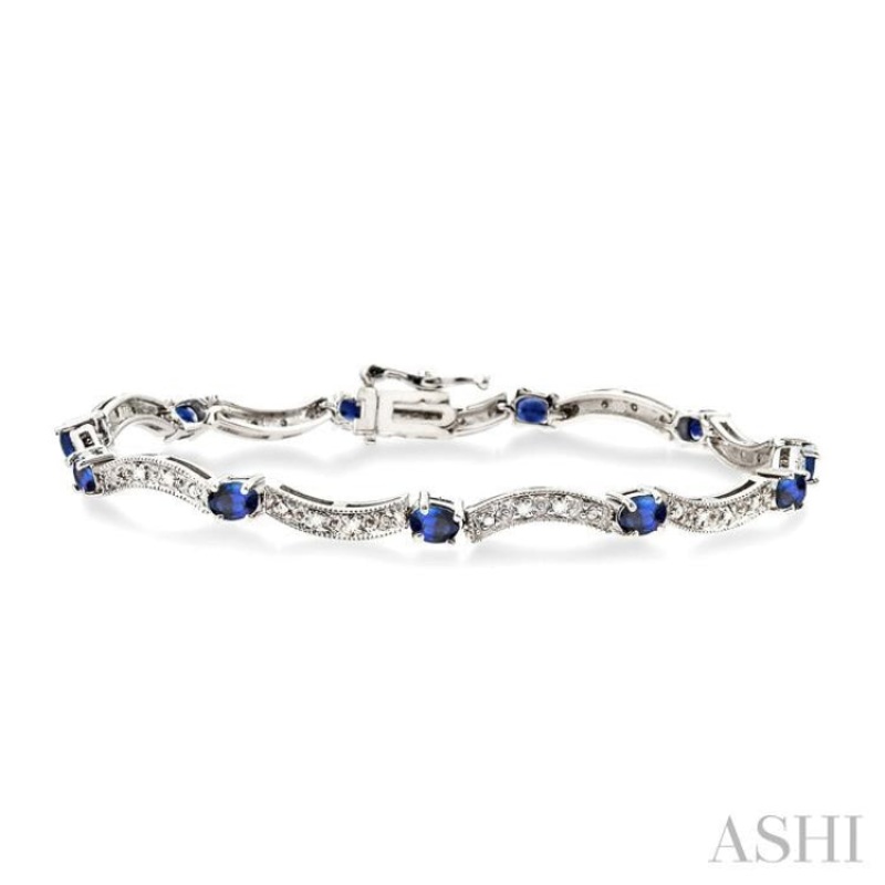 4×3 MM Oval Cut Sapphire and 1/10 ctw Single Cut Diamond Bracelet in 14K White Gold